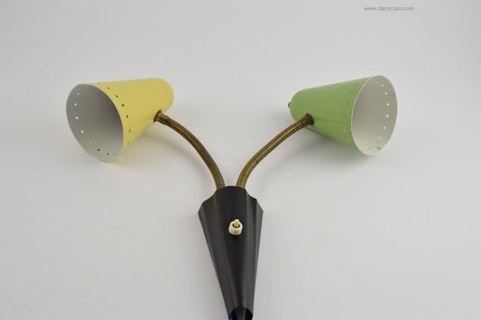 Hala soft yellow and green wall light, sconce from busquet with star cut pattern