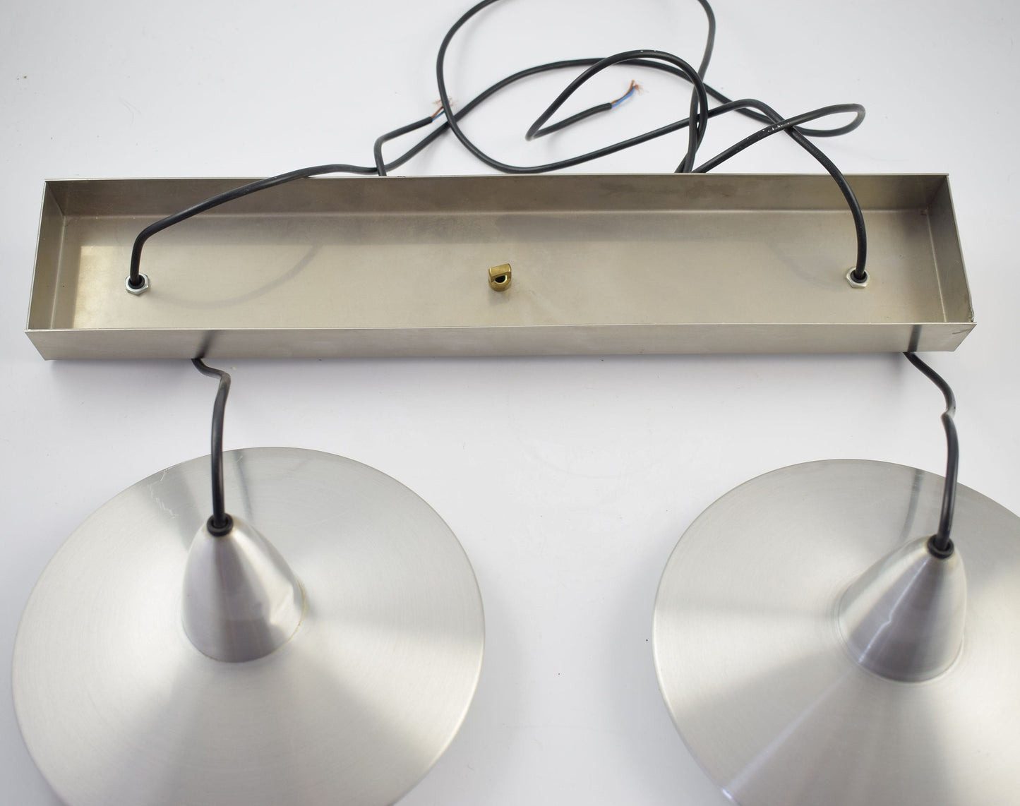 Two Aluminum hanging lamps, plus metal bar, in the shape of an ufo from dutch design company Hala.