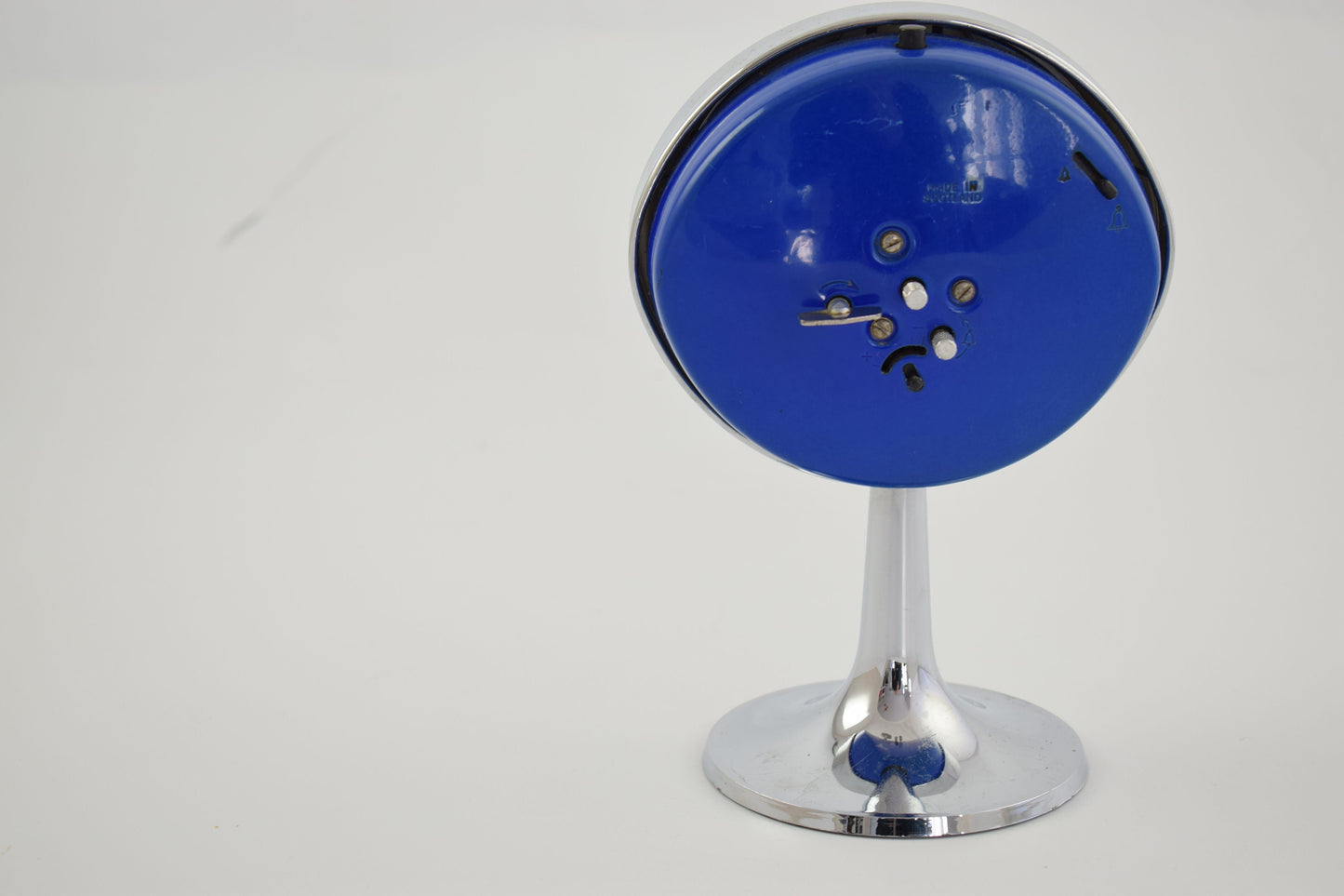 Westclox blue Big Ben Alarm Oval clock on tall pedestal with round base.